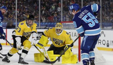 Feb 1, 2026; Tampa Bay, Florida, USA; Tampa Bay Lightning center Jake Guentzel (59) shoots the puck as Boston Bruins goaltender Jeremy Swayman (1) and defenseman Charlie McAvoy (73) defend during the second period in the 2026 Stadium Series ice hockey game at Raymond James Stadium. Mandatory Credit: Kim Klement Neitzel-Imagn Images