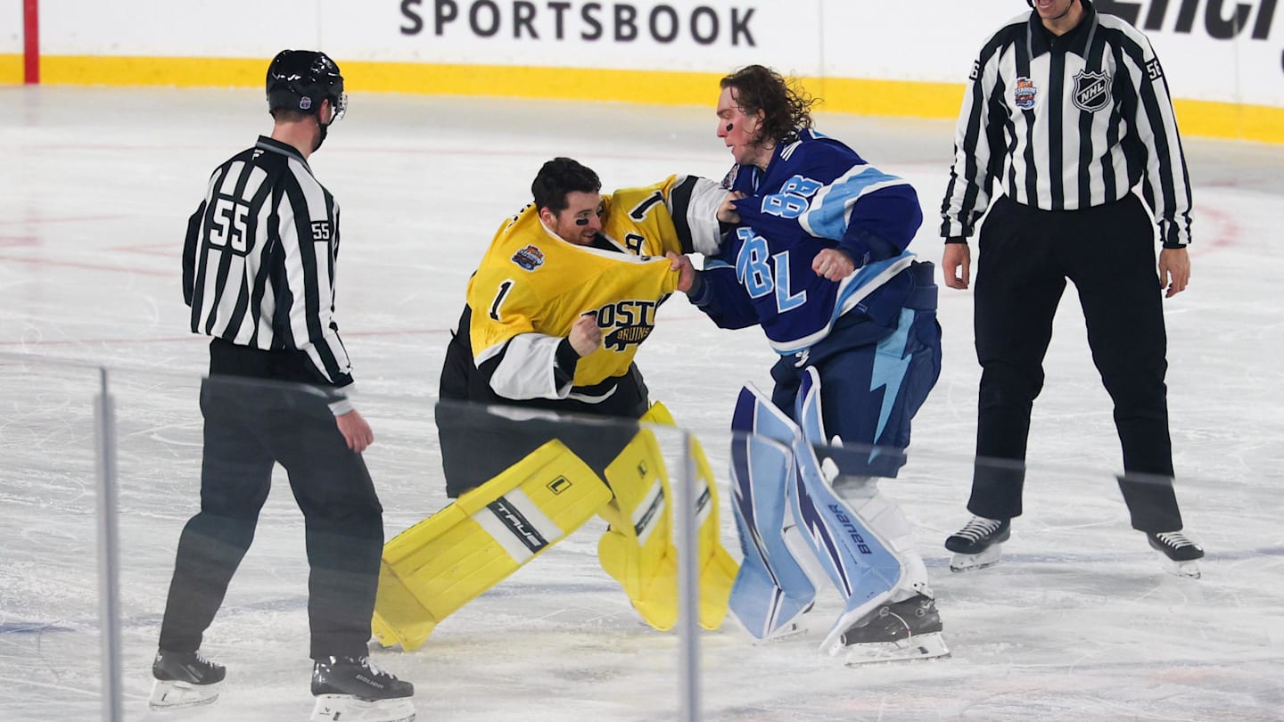 Feb 1, 2026; Tampa Bay, Florida, USA; Boston Bruins goaltender Jeremy Swayman (1) and Tampa Bay Lightning goaltender Andrei Vasilevskiy (88) exchange punches as officials Kyle Flemington and Julien Fournier look on during the second period in the 2026 Stadium Series ice hockey game at Raymond James Stadium. Mandatory Credit: Nathan Ray Seebeck-Imagn Images
