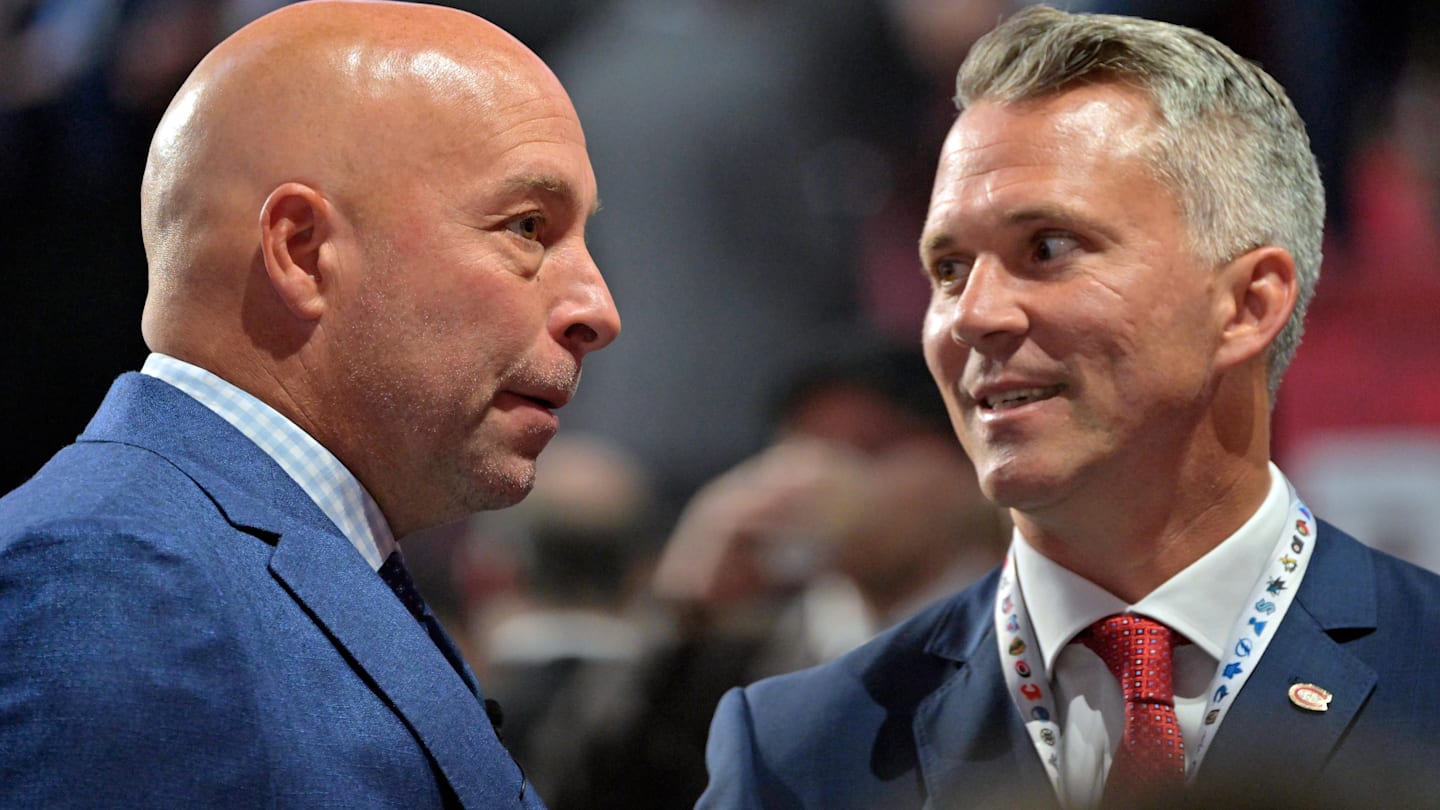 Jul 7, 2022; Montreal, Quebec, CANADA; Montreal Canadiens general manager Kent Hughes (left) talks with head coach Martin St. Louis before the first round of the 2022 NHL Draft at Bell Centre. Mandatory Credit: Eric Bolte-Imagn Images