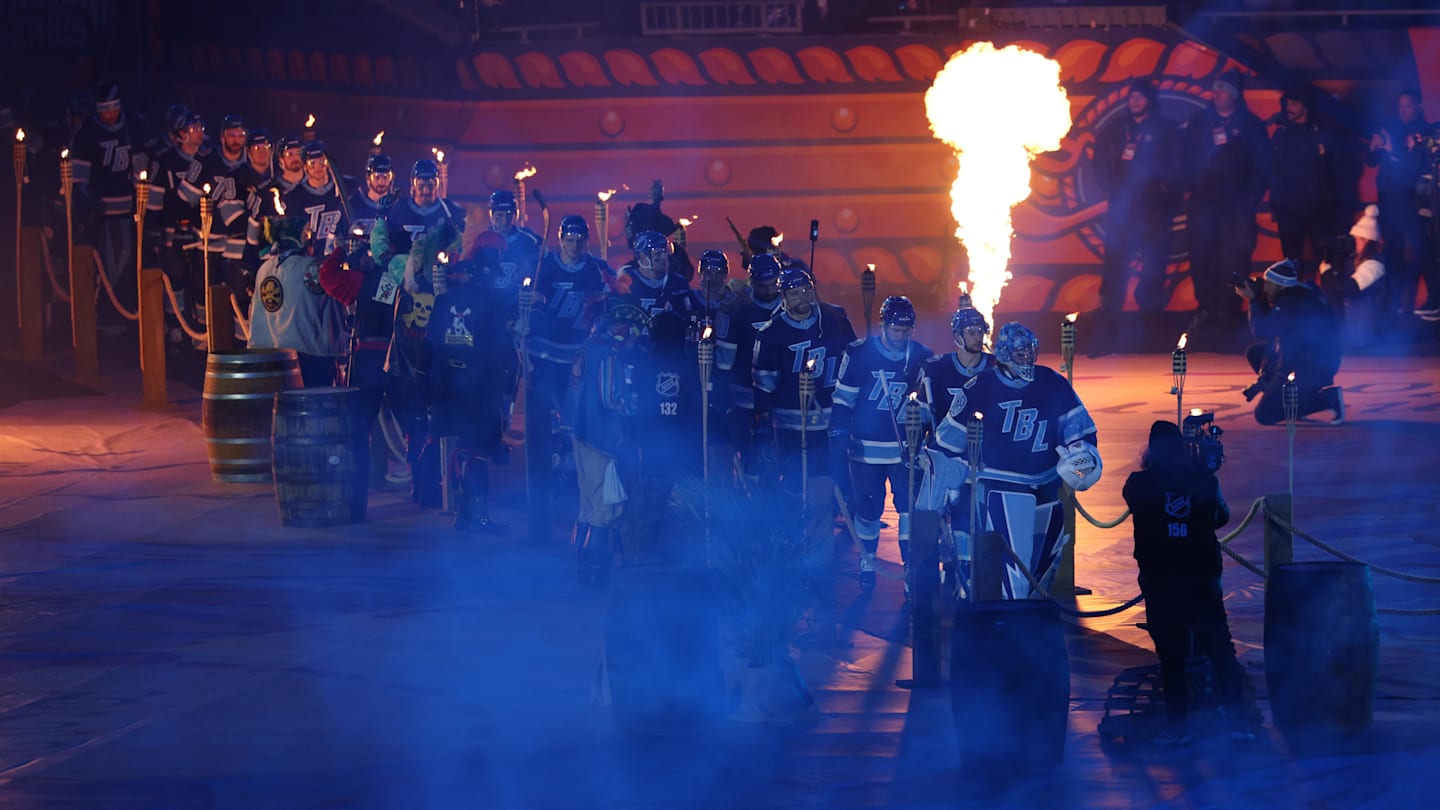 Feb 1, 2026; Tampa Bay, Florida, USA; The Tampa Bay Lightning make their entrance to the ice in the 2026 Stadium Series ice hockey game against the Boston Bruins at Raymond James Stadium. Mandatory Credit: Nathan Ray Seebeck-Imagn Images