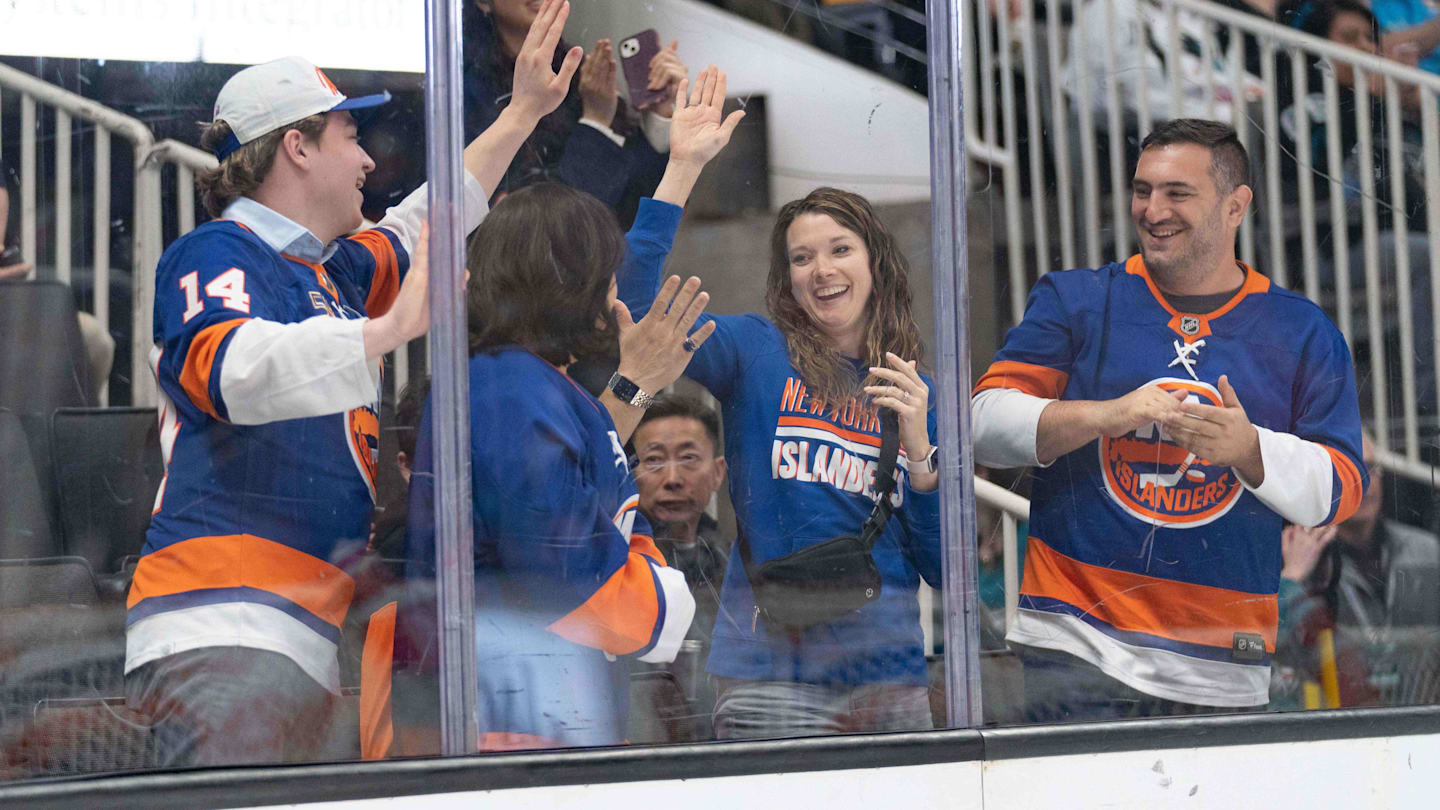 Mar 7, 2024; San Jose, California, USA; New York Islanders fans celebrate during the second period against the San Jose Sharks at SAP Center at San Jose. Mandatory Credit: Stan Szeto-Imagn Images