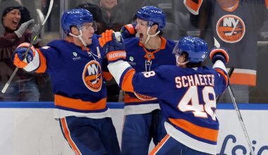 Feb 3, 2026; Elmont, New York, USA; New York Islanders center Bo Horvat (14) celebrates his game winning overtime goal against the Pittsburgh Penguins with center Mathew Barzal (13) and defenseman Matthew Schaefer (48) at UBS Arena. Mandatory Credit: Brad Penner-Imagn Images