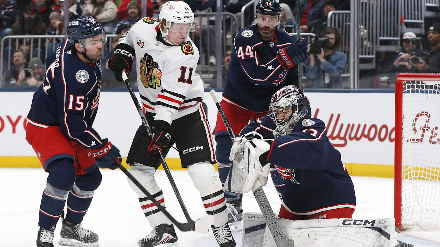 Blue Jackets goaltender Jet Greaves makes a save through traffic.