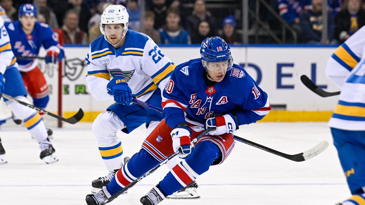 Nov 24, 2025; New York, New York, USA;  New York Rangers left wing Artemi Panarin (10) skates with the puck defended by St. Louis Blues center Pius Suter (22) during the first period at Madison Square Garden. Mandatory Credit: Dennis Schneidler-Imagn Images