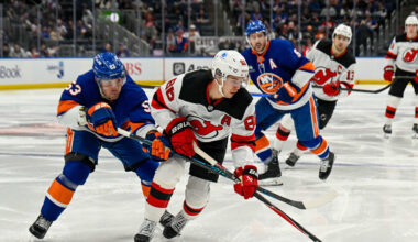 Jan 6, 2026; Elmont, New York, USA;  New York Islanders center Casey Cizikas (53) defends against New Jersey Devils center Jack Hughes (86) during the third period at UBS Arena. Mandatory Credit: Dennis Schneidler-Imagn Images
