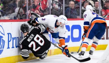 New York Islanders defenseman Adam Pelech (3) checks New Jersey Devils right wing Timo Meier (28): John Jones-Imagn Images