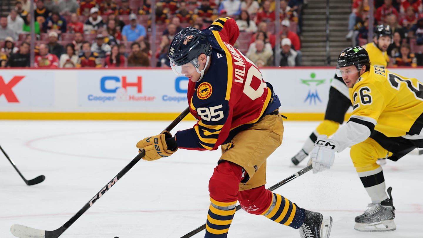 Feb 4, 2026; Sunrise, Florida, USA; Florida Panthers left wing Sandis Vilmanis (95) moves the puck against the Boston Bruins during the first period at Amerant Bank Arena. Mandatory Credit: Sam Navarro-Imagn Images