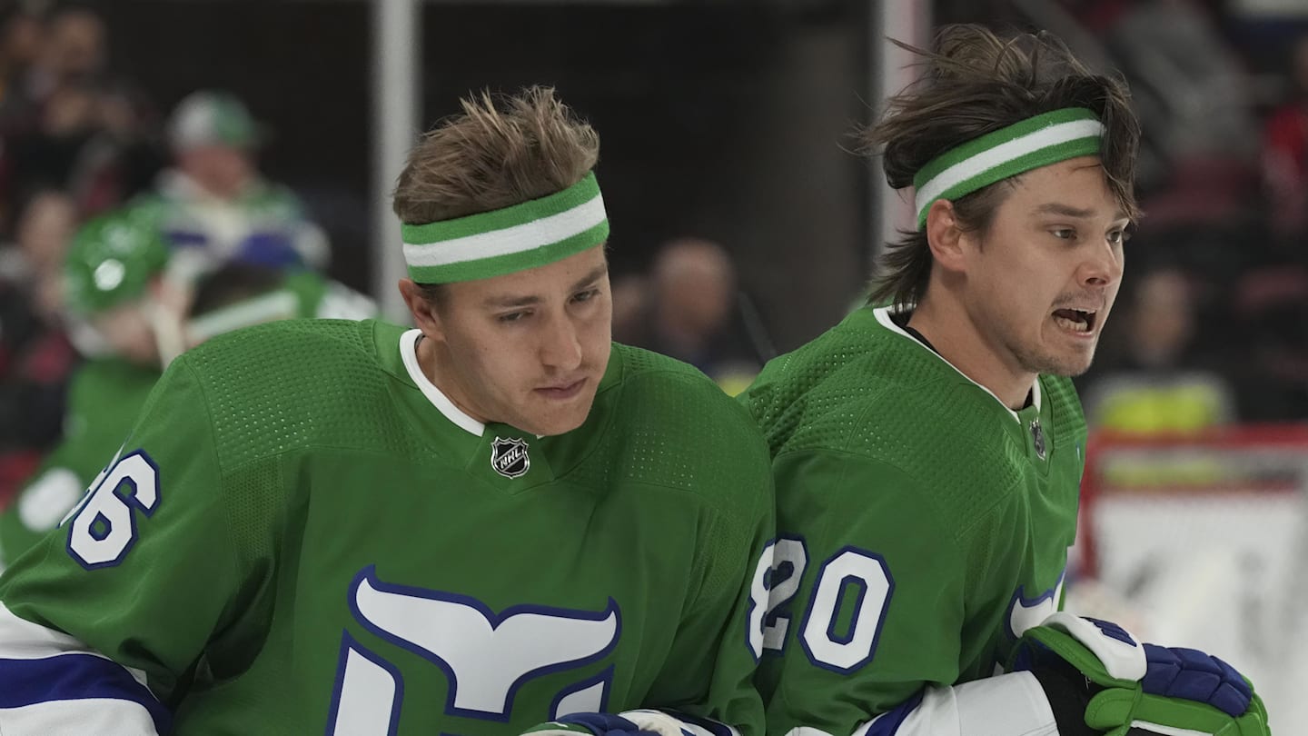 Mar 26, 2023; Raleigh, North Carolina, USA;  Carolina Hurricanes center Sebastian Aho (20) and Carolina Hurricanes left wing Teuvo Teravainen (86) interact during the warmups before the game against the Boston Bruins at PNC Arena. Mandatory Credit: James Guillory-Imagn Images