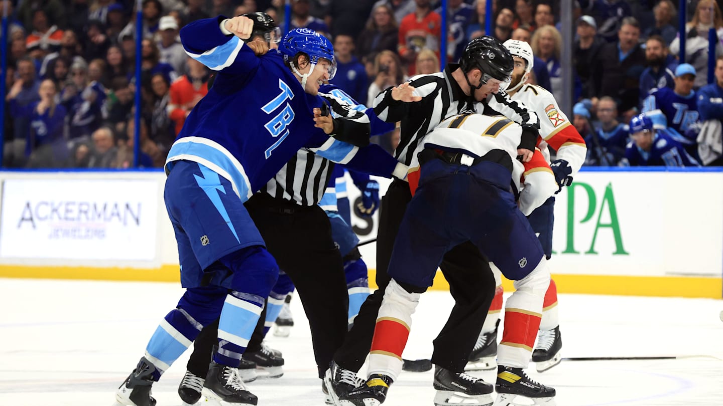 Feb 5, 2026; Tampa, Florida, USA; Tampa Bay Lightning center Curtis Douglas (42) and Florida Panthers defenseman Niko Mikkola (77) fight during the third period at Benchmark International Arena. Mandatory Credit: Kim Klement Neitzel-Imagn Images