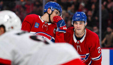 Oct 12, 2024; Montreal, Quebec, CAN; Montreal Canadiens center Nick Suzuki (14) discusses with left wing Juraj Slafkovsky (20) prior to a face-off against the Ottawa Senators during the first period at Bell Centre. Mandatory Credit: David Kirouac-Imagn Images