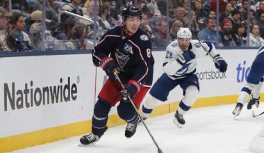 Oct 18, 2025; Columbus, Ohio, USA; Columbus Blue Jackets defenseman Zach Werenski (8) controls the puck defended by Tampa Bay Lightning center Brayden Point (21) during the third period at Nationwide Arena. Mandatory Credit: Russell LaBounty-Imagn Images