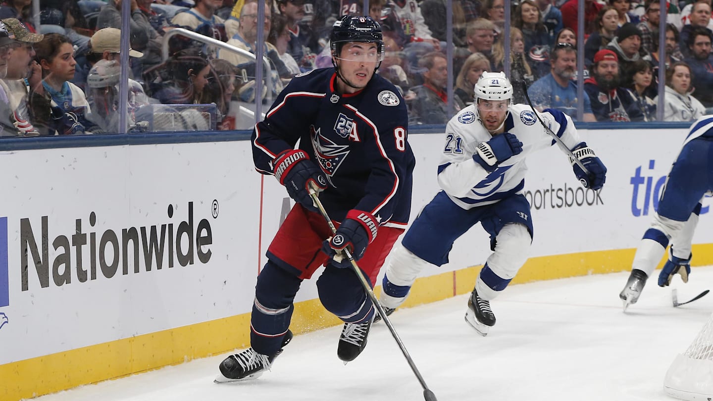 Oct 18, 2025; Columbus, Ohio, USA; Columbus Blue Jackets defenseman Zach Werenski (8) controls the puck defended by Tampa Bay Lightning center Brayden Point (21) during the third period at Nationwide Arena. Mandatory Credit: Russell LaBounty-Imagn Images