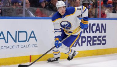 Jan 24, 2026; Elmont, New York, USA; Buffalo Sabres defenseman Michael Kesselring (8) skates with the puck against the New York Islanders during the second period at UBS Arena. Mandatory Credit: Brad Penner-Imagn Images