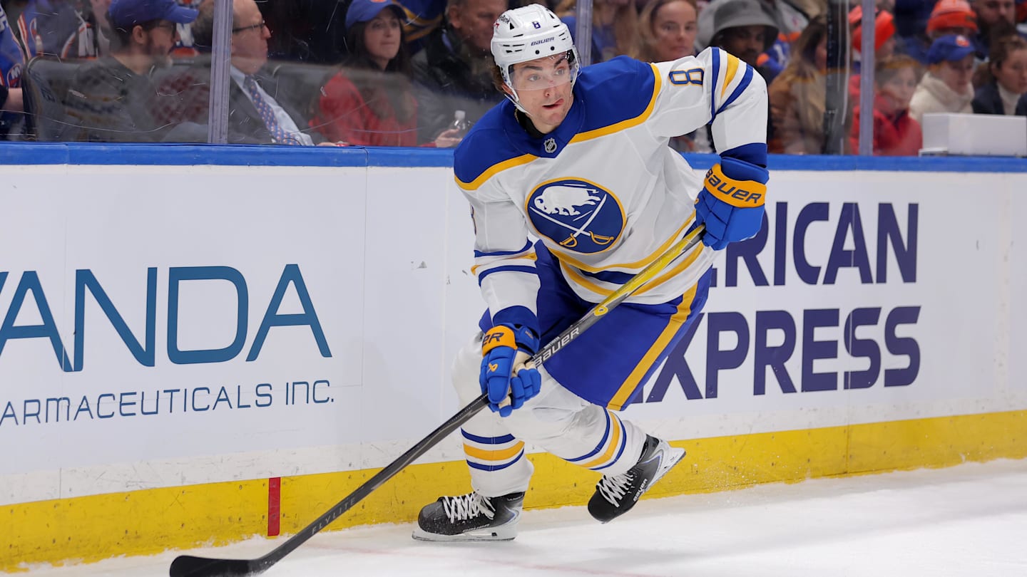 Jan 24, 2026; Elmont, New York, USA; Buffalo Sabres defenseman Michael Kesselring (8) skates with the puck against the New York Islanders during the second period at UBS Arena. Mandatory Credit: Brad Penner-Imagn Images