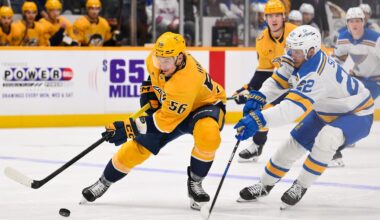 Feb 2, 2026; Nashville, Tennessee, USA;  Nashville Predators left wing Erik Haula (56) and St. Louis Blues center Pius Suter (22) battle for the puck during the first period at Bridgestone Arena. Mandatory Credit: Steve Roberts-Imagn Images