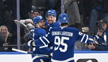 Oct 16, 2025; Toronto, Ontario, CAN; Toronto Maple Leafs forward Auston Matthews (34) celebrates with forward William Nylander (88) and defenseman Oliver Ekman-Larsson (95) after scoring the winning goal against the New York Rangers in overtime at Scotiabank Arena. Mandatory Credit: Dan Hamilton-Imagn Images