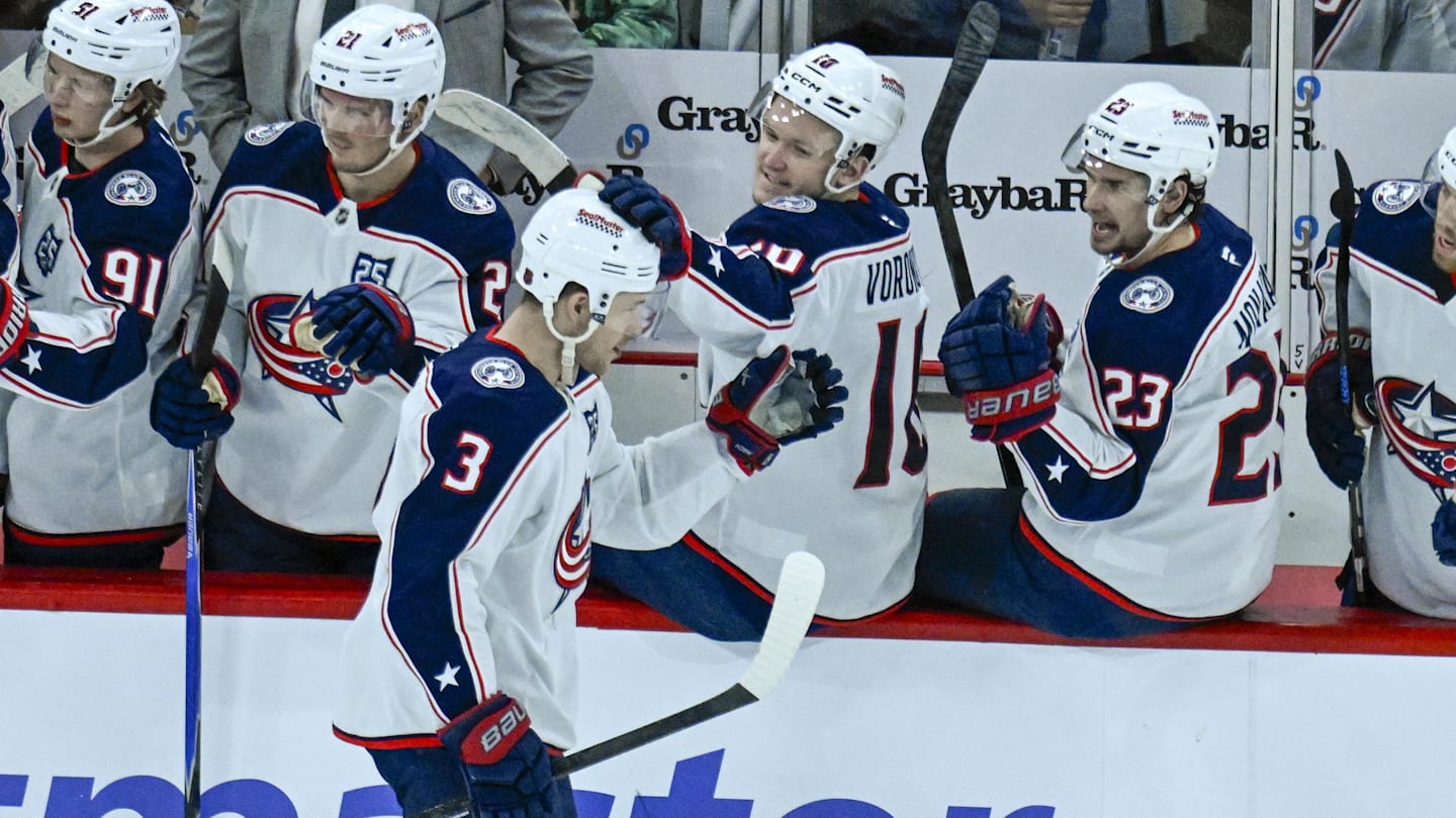 Blue Jackets center Charlie Coyle celebrates a goal with his bench.
