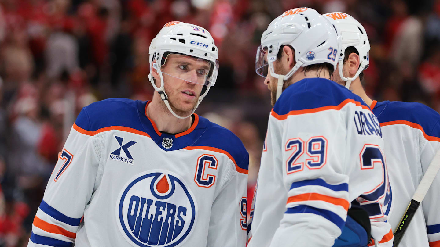 Nov 22, 2025; Sunrise, Florida, USA; Edmonton Oilers center Connor McDavid (97) speaks to center Leon Draisaitl (29) against the Florida Panthers during the second period at Amerant Bank Arena. Mandatory Credit: Sam Navarro-Imagn Images
