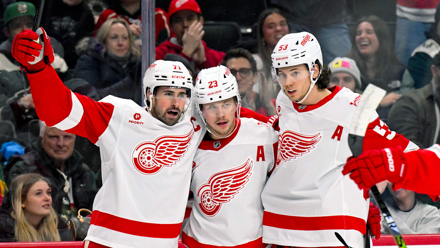 Jan 22, 2026; Saint Paul, Minnesota, USA;  Detroit Red Wings forward Lucas Raymond (23) celebrates his power play goal against the Minnesota Wild with forward Dylan Larkin (71) and defensemen Moritz Seider (53) during the first period at Grand Casino Arena. Mandatory Credit: Nick Wosika-Imagn Images