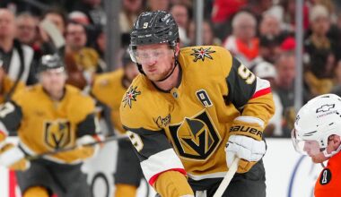 Jan 19, 2026; Las Vegas, Nevada, USA; Philadelphia Flyers right wing Carl Grundstrom (91) tips the puck away from Vegas Golden Knights center Jack Eichel (9) during the third period at T-Mobile Arena. Mandatory Credit: Stephen R. Sylvanie-Imagn Images