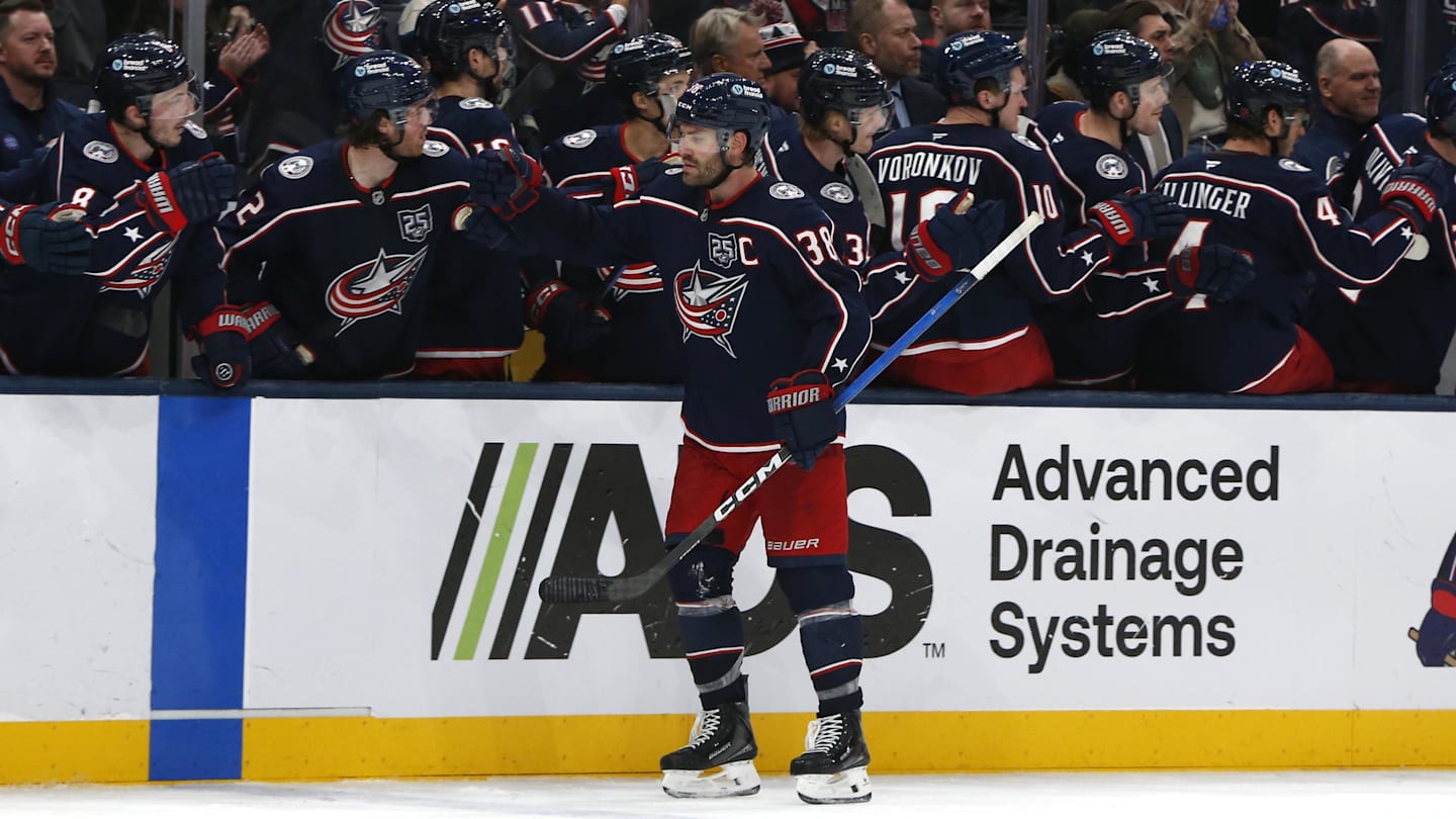Blue Jackets captain Boone Jenner celebrates a goal with his teammates.