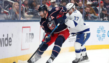 Jan 24, 2026; Columbus, Ohio, USA;  Columbus Blue Jackets defenseman Erik Gudbranson (44) controls the puck as Tampa Bay Lightning center Yanni Gourde (37) defends during the first period at Nationwide Arena. Mandatory Credit: Joseph Maiorana-Imagn Images