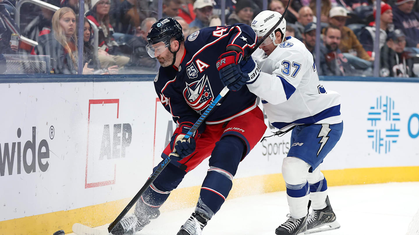 Jan 24, 2026; Columbus, Ohio, USA;  Columbus Blue Jackets defenseman Erik Gudbranson (44) controls the puck as Tampa Bay Lightning center Yanni Gourde (37) defends during the first period at Nationwide Arena. Mandatory Credit: Joseph Maiorana-Imagn Images