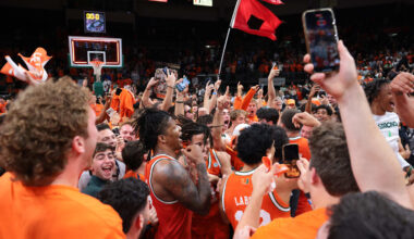 Feb 10, 2026; Coral Gables, Florida, USA; Miami Hurricanes forward Shelton Henderson (7) celebrates with teammates as fans storm the court after the game against the North Carolina Tar Heels at Watsco Center. Mandatory Credit: Sam Navarro-Imagn Images