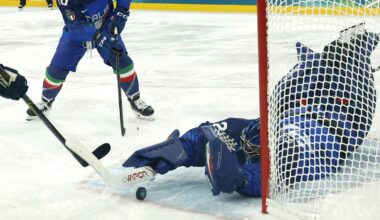 Feb 11, 2026; Milan, Italy;  Damian Clara of Italy and Alex Trivellato of Italy in action with Joel Eriksson Ek of Sweden in men's ice hockey group B play during the Milano Cortina 2026 Olympic Winter Games at Milano Santagiulia Ice Hockey Arena. Mandatory Credit: Geoff Burke-Imagn Images