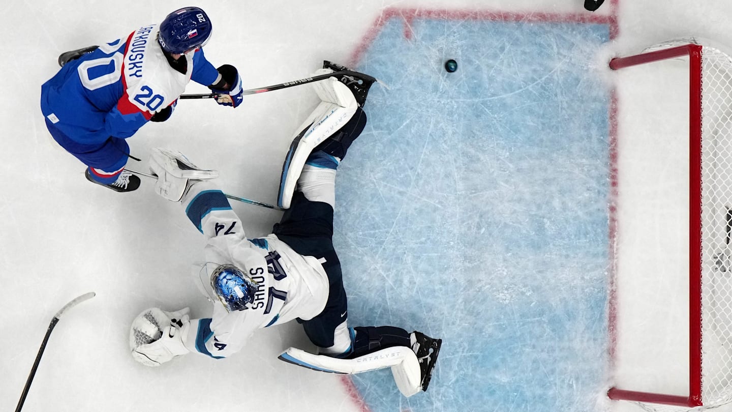[US, Mexico & Canada customers only] Feb 11, 2026; Milan, Italy; Juraj Slafkovsky of Slovakia scores their first goal past Juuse Saros of Finland in men's ice hockey group B play during the Milano Cortina 2026 Olympic Winter Games at Milano Santagiulia Ice Hockey Arena. Mandatory Credit: Mike Segar/Reuters via Imagn Images