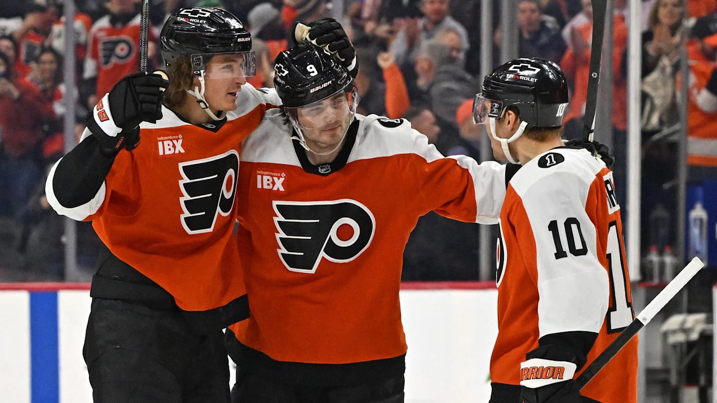 Feb 3, 2026; Philadelphia, Pennsylvania, USA; Philadelphia Flyers defenseman Jamie Drysdale (9) celebrates his goal with center Trevor Zegras (46) and right wing Bobby Brink (10) against the Washington Capitals during the third period at Xfinity Mobile Arena.