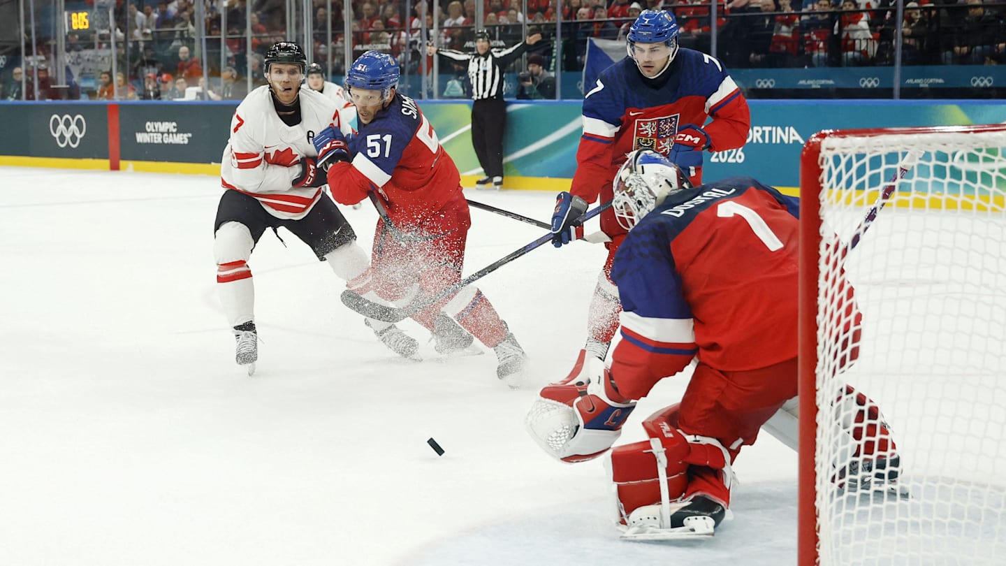 Feb 12, 2026; Milan, Italy;  Lukas Dostal of Czechia makes a save against Canada in a men's ice hockey group A match during the Milano Cortina 2026 Olympic Winter Games at Milano Santagiulia Ice Hockey Arena. Mandatory Credit: Geoff Burke-Imagn Images