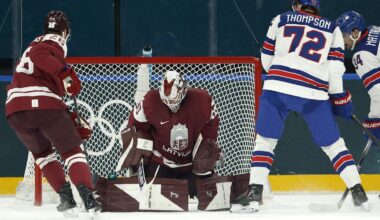 Team Latvia and Columbus Blue Jackets goaltender Elvis Merzlikins makes a save against team USA.