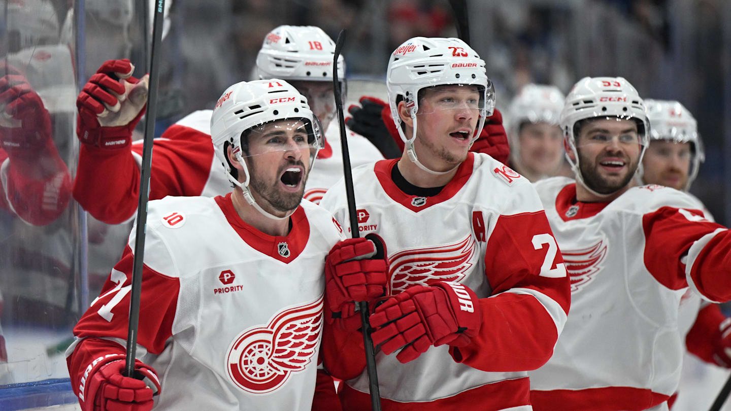 Jan 21, 2026; Toronto, Ontario, CAN;  Detroit Red Wings forward Dylan Larkin (71) celebrates with forward Lucas Raymond (23) and teammates after scoring the winning goal in overtime against the Toronto Maple Leafs at Scotiabank Arena. Mandatory Credit: Dan Hamilton-Imagn Images