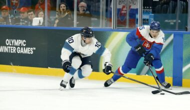 Feb 11, 2026; Milan, Italy; Dalibor Dvorsky of Slovakia in action with Henri Jokiharju of Finland in men's ice hockey group B play during the Milano Cortina 2026 Olympic Winter Games at Milano Santagiulia Ice Hockey Arena. Mandatory Credit: Geoff Burke-Imagn Images