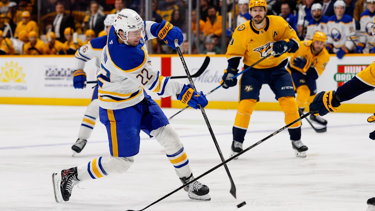 Jan 20, 2026; Nashville, Tennessee, USA;  Buffalo Sabres right wing Jack Quinn (22) takes a shot on goal against the Nashville Predators during the second period at Bridgestone Arena. Mandatory Credit: Steve Roberts-Imagn Images