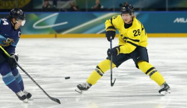 Feb 13, 2026; Milan, Italy; Mikael Granlund of Finland in action with Rasmus Dahlin of Sweden in men's ice hockey group B play during the Milano Cortina 2026 Olympic Winter Games at Milano Santagiulia Ice Hockey Arena. Mandatory Credit: Geoff Burke-Imagn Images