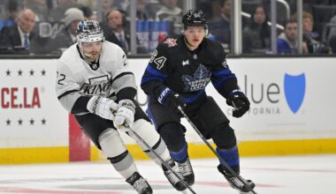 Jan 2, 2024; Los Angeles, California, USA; Los Angeles Kings left wing Kevin Fiala (22) skates the puck past Toronto Maple Leafs center David Kampf (64) in the second period at Crypto.com Arena. Mandatory Credit: Jayne Kamin-Oncea-Imagn Images