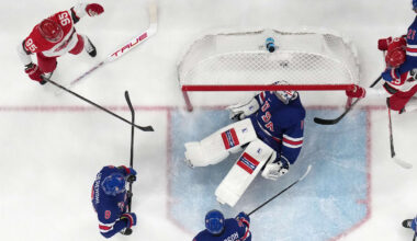 Feb 14, 2026; Milan, Italy;  Jeremy Swayman of United States saves a shot from Patrick Russell of Denmark in men's ice hockey group C play during the Milano Cortina 2026 Olympic Winter Games at Milano Santagiulia Ice Hockey Arena. Mandatory Credit: Geoff Burke-Imagn Images