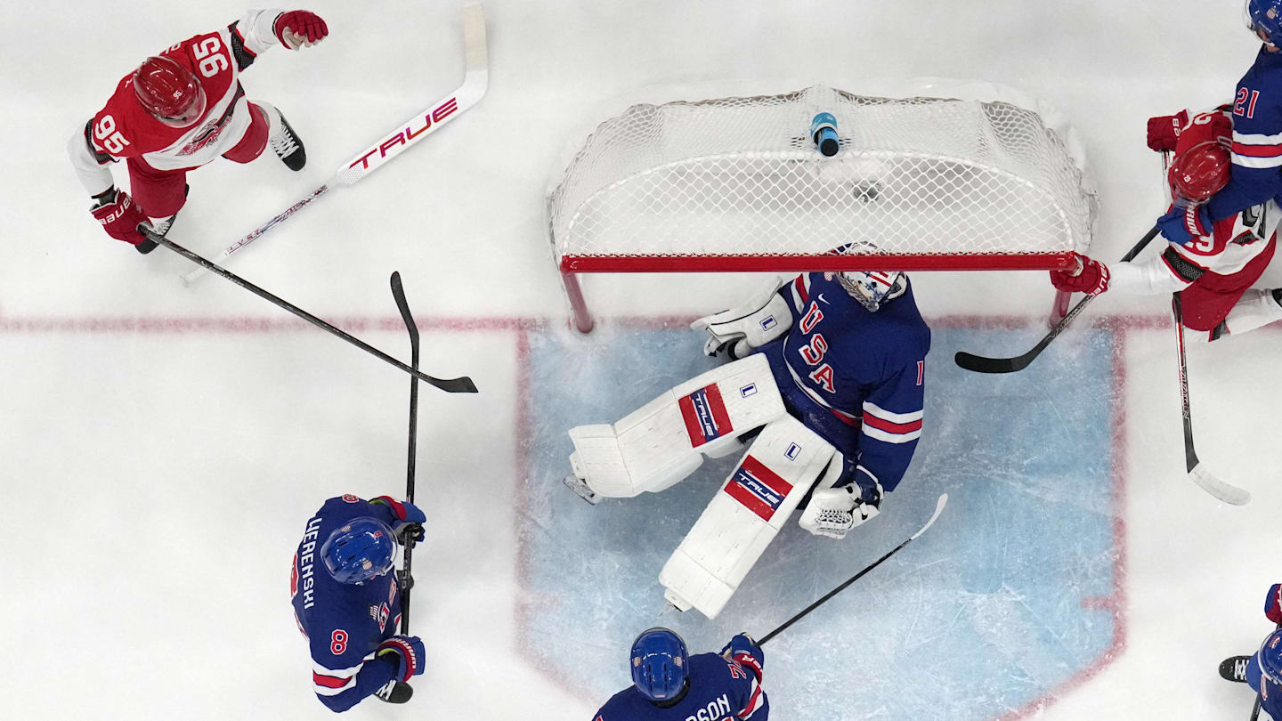 [US, Mexico & Canada customers only] Feb 14, 2026; Milan, Italy; Nick Olesen of Denmark scores their first goal past Jeremy Swayman of the United States in men's ice hockey group C play during the Milano Cortina 2026 Olympic Winter Games at Milano Santagiulia Ice Hockey Arena. Mandatory Credit: Mike Segar/Reuters via Imagn Images