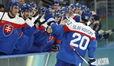 Feb 11, 2026; Milan, Italy;  Juraj Slafkovsky of Slovakia celebrates scoring their third goal with teammates against Finland in men's ice hockey group B play during the Milano Cortina 2026 Olympic Winter Games at Milano Santagiulia Ice Hockey Arena. Mandatory Credit: Geoff Burke-Imagn Images
