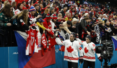 Feb 12, 2026; Milan, Italy; Mitch Marner and Mark Stone of Canada celebrate with fans after the match against Czechia  in a men's ice hockey group A match during the Milano Cortina 2026 Olympic Winter Games at Milano Santagiulia Ice Hockey Arena. Mandatory Credit: Geoff Burke-Imagn Images