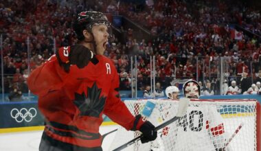 Feb 13, 2026; Milan, Italy;  Connor McDavid of Canada celebrates after scoring their first goal  against Switzerland in men's ice hockey group A play during the Milano Cortina 2026 Olympic Winter Games at Milano Santagiulia Ice Hockey Arena. Mandatory Credit: Geoff Burke-Imagn Images