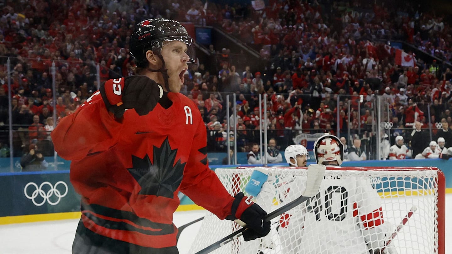 Feb 13, 2026; Milan, Italy;  Connor McDavid of Canada celebrates after scoring their first goal  against Switzerland in men's ice hockey group A play during the Milano Cortina 2026 Olympic Winter Games at Milano Santagiulia Ice Hockey Arena. Mandatory Credit: Geoff Burke-Imagn Images