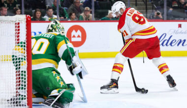 Nov 9, 2025; Saint Paul, Minnesota, USA; Calgary Flames center Nazem Kadri (91) shoots the puck against Minnesota Wild goaltender Jesper Wallstedt (30) during the third period at Grand Casino Arena. Mandatory Credit: Matt Krohn-Imagn Images