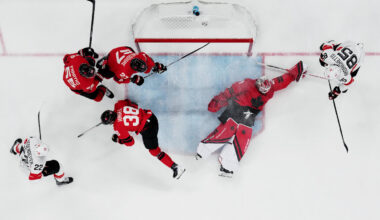 [US, Mexico & Canada customers only] Feb 13, 2026; Milan, Italy; Logan Thompson, Colton Parayko, Brandon Hagel and Shea Theodore of Canada in action with Nino Niederreiter and Sven Andrighetto of Switzerland in men's ice hockey group A play during the Milano Cortina 2026 Olympic Winter Games at Milano Santagiulia Ice Hockey Arena. Mandatory Credit: Marton Monus/Reuters via Imagn Images