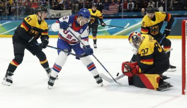 Feb 15, 2026; Milan, Italy; Matthew Tkachuk of United States in action with Maximilian Franzreb of Germany in men's ice hockey group C play during the Milano Cortina 2026 Olympic Winter Games at Milano Santagiulia Ice Hockey Arena. Mandatory Credit: Geoff Burke-Imagn Images