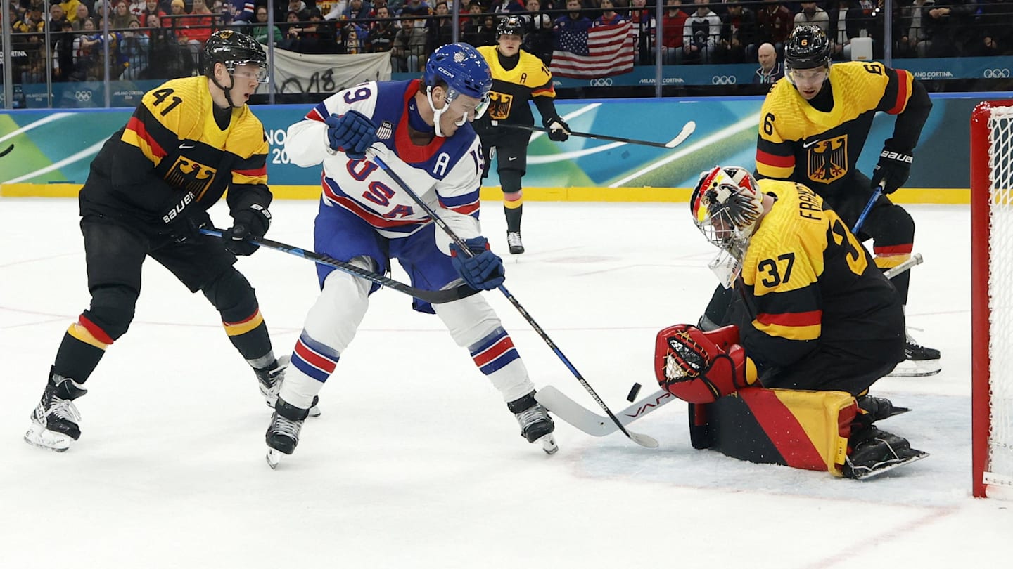 Feb 15, 2026; Milan, Italy; Matthew Tkachuk of United States in action with Maximilian Franzreb of Germany in men's ice hockey group C play during the Milano Cortina 2026 Olympic Winter Games at Milano Santagiulia Ice Hockey Arena. Mandatory Credit: Geoff Burke-Imagn Images