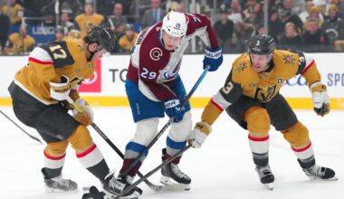 Dec 27, 2025; Las Vegas, Nevada, USA; Colorado Avalanche center Nathan MacKinnon (29) loses the puck between Vegas Golden Knights defenseman Ben Hutton (17) and defenseman Brayden McNabb (3) during the first period at T-Mobile Arena. Mandatory Credit: Stephen R. Sylvanie-Imagn Images