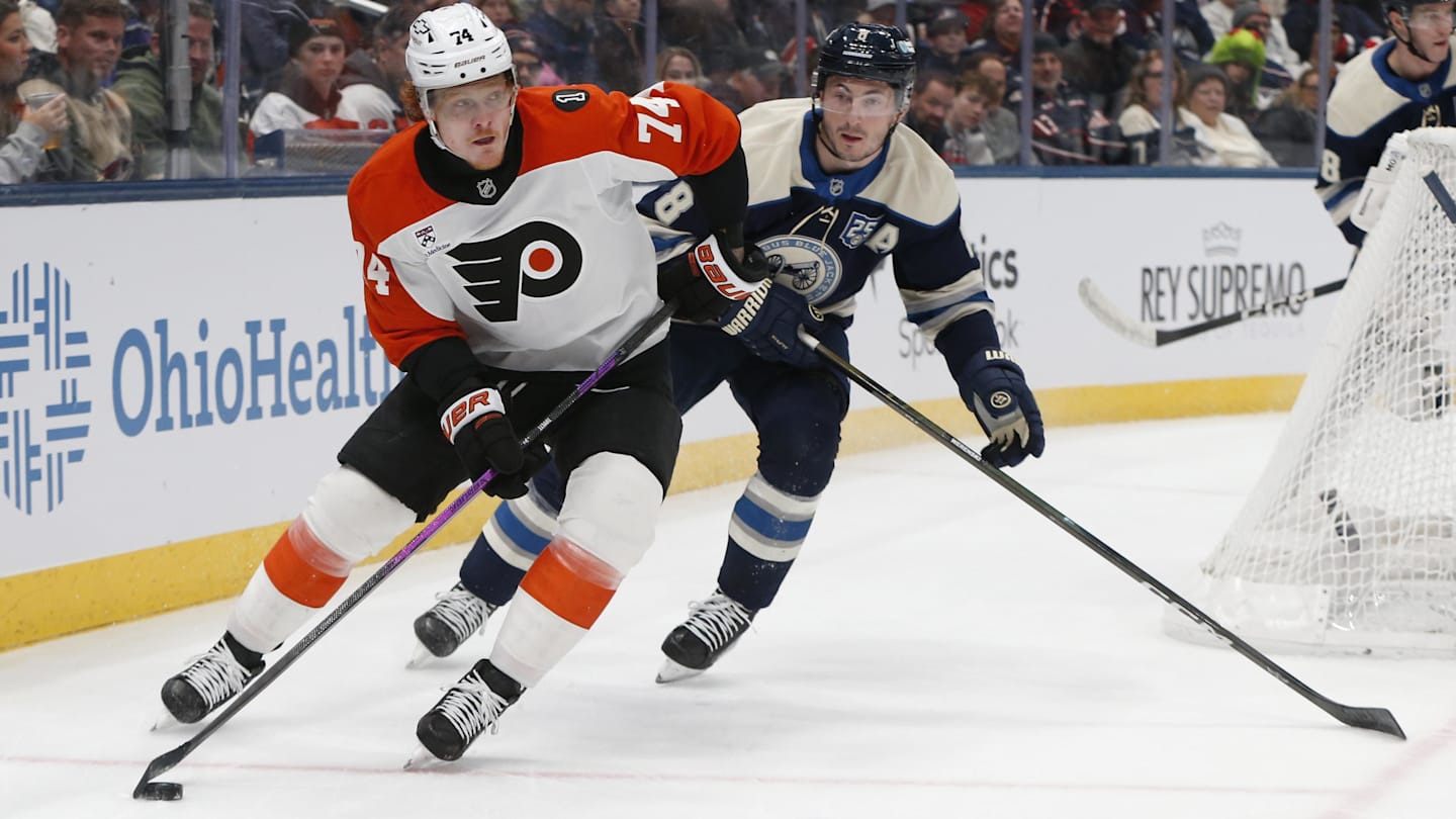 Detroit Red Wings center Michael Rasmussen (27) and Philadelphia Flyers center Rodrigo Abols (18) battle for position at Wells Fargo Center. Mandatory Credit: Eric Hartline-Imagn Images